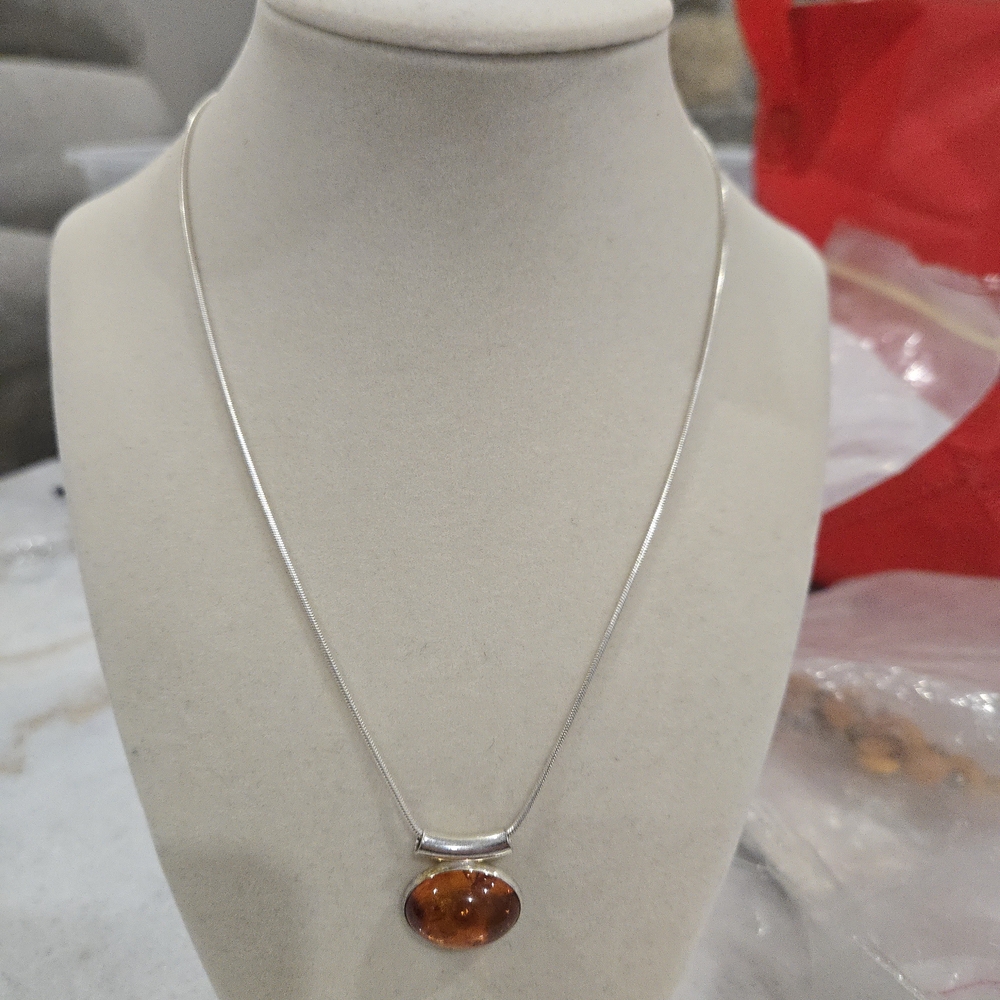 Elegant Silver Necklace with Amber Pendant